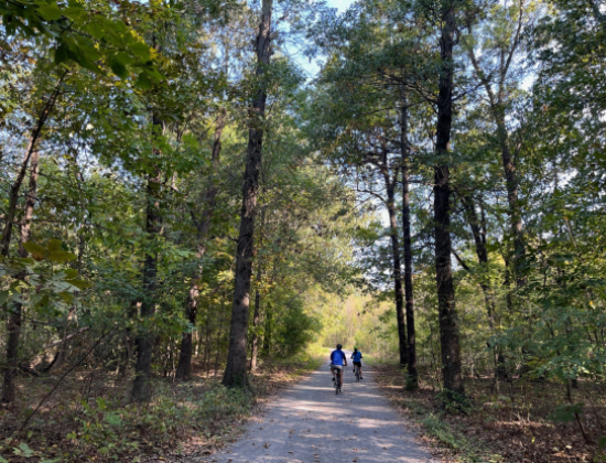 Cyclists on gravel section of Greenway Trail